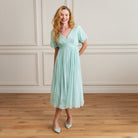 Woman wearing a sea green dress 