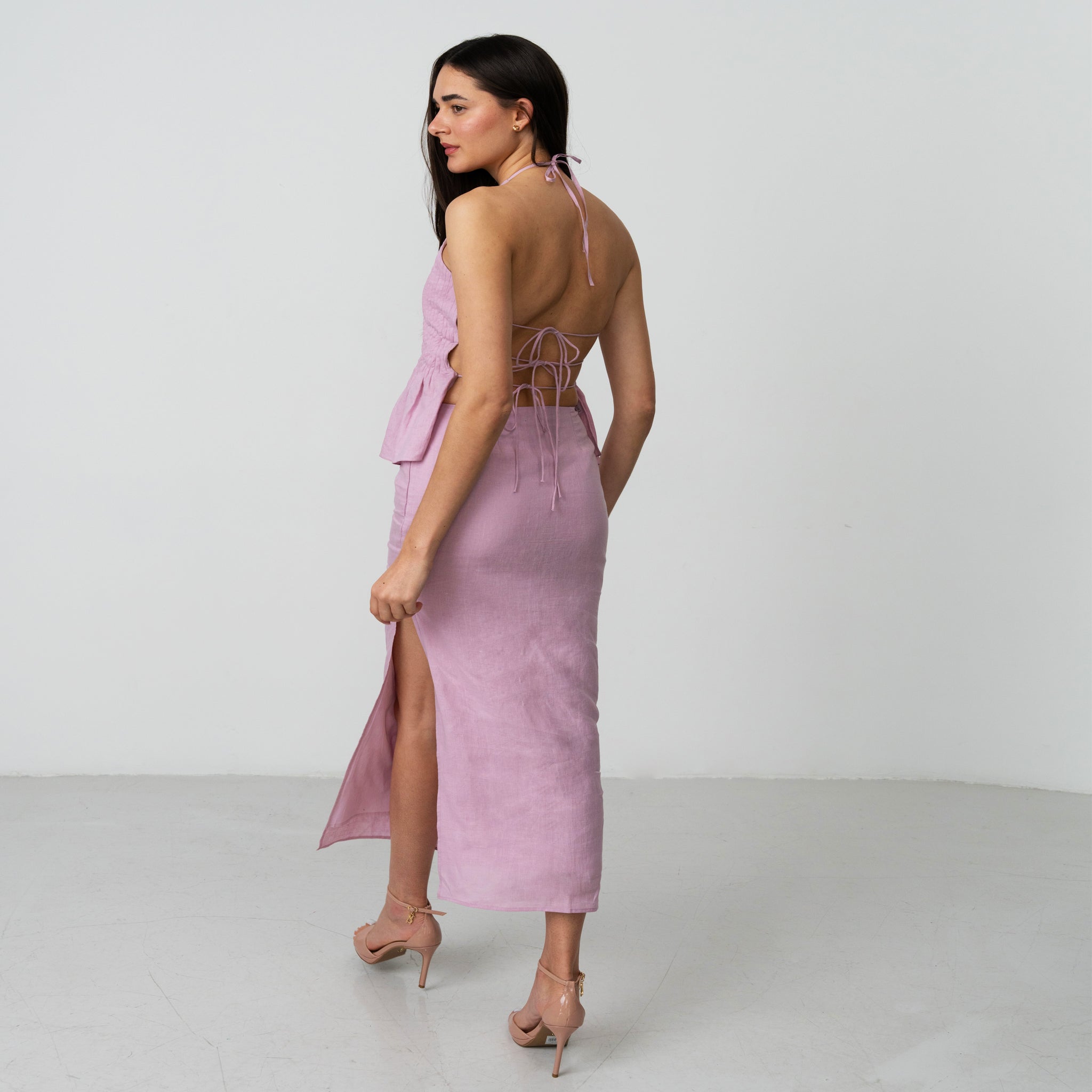 women wearing a pencil skirt with high slits in premium linen fabric